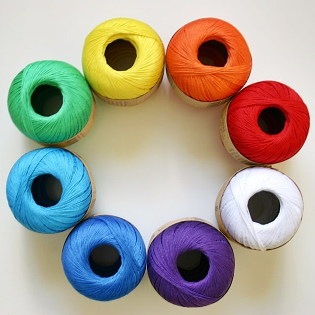 Rainbow of colorful balls of thread in circle, Scheepjes Sweet Treat, Susan Carlson of Felted Button | Colorful Crochet Patterns