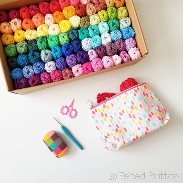 Scheepjes Cahlista colorful cotton yarn pack with 84 rainbow colors in bin, with crochet hook, scissors and project pouch, yarn review by  by Susan Carlson of Felted Button colorful crochet patterns