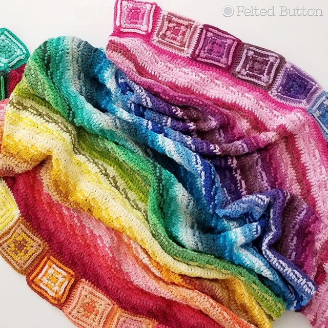 Brightly colored rainbow stored cotton Crochet blanket made with Scheepjes Cahlista, Every Bit a Blanket, free crochet pattern  by Susan Carlson of Felted Button colorful crochet patterns 