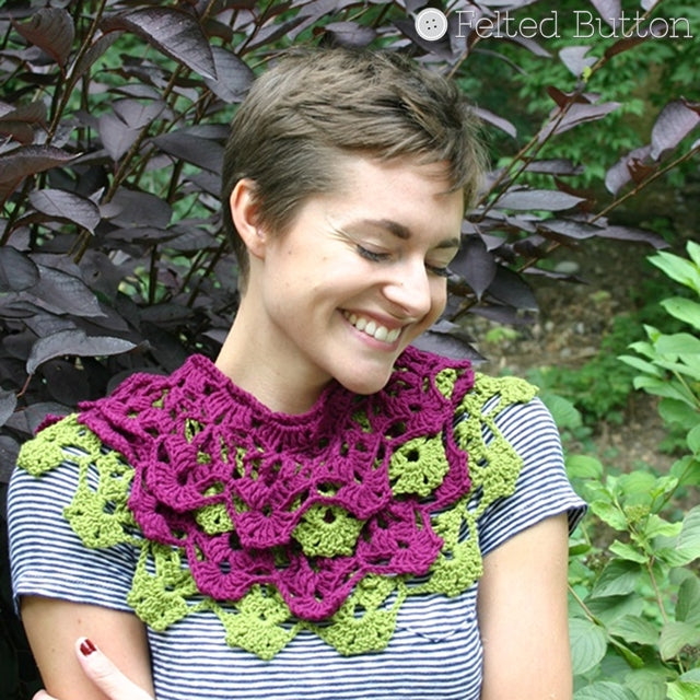 Pretty girl wearing pink and green lacey and detailed cowl, Garden Terrace Infinity Scarf, cowl crochet pattern by Susan Carlson of Felted Button | Colorful Crochet Patterns
