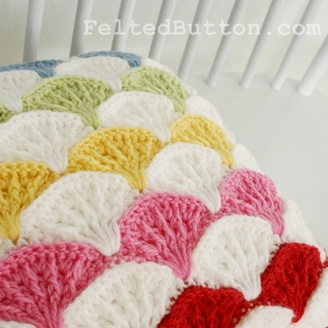 Paintbrush pillow and afghan crochet pattern in rainbow by Susan Carlson of Felted Button | Colorful Crochet Patterns
