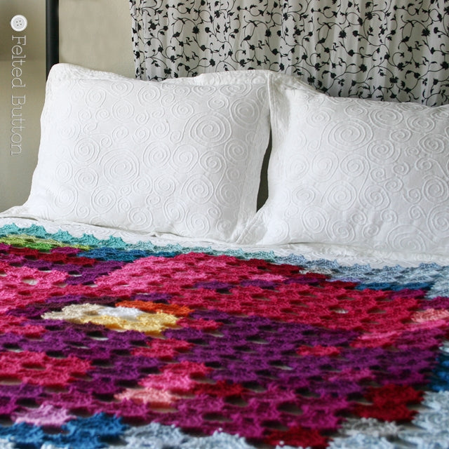Pointillism Posie Blanket, crochet art blanket made with pixels or motifs that resembles large pink posie flower, crochet pattern by Susan Carlson of Felted Button | Colorful Crochet Patterns