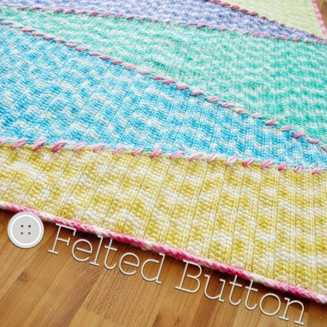 Sally Blanket, large colorful triangles in blue, green and yellow with pink stitching and border, crochet pattern by Susan Carlson of Felted Button | Colorful Crochet Patterns