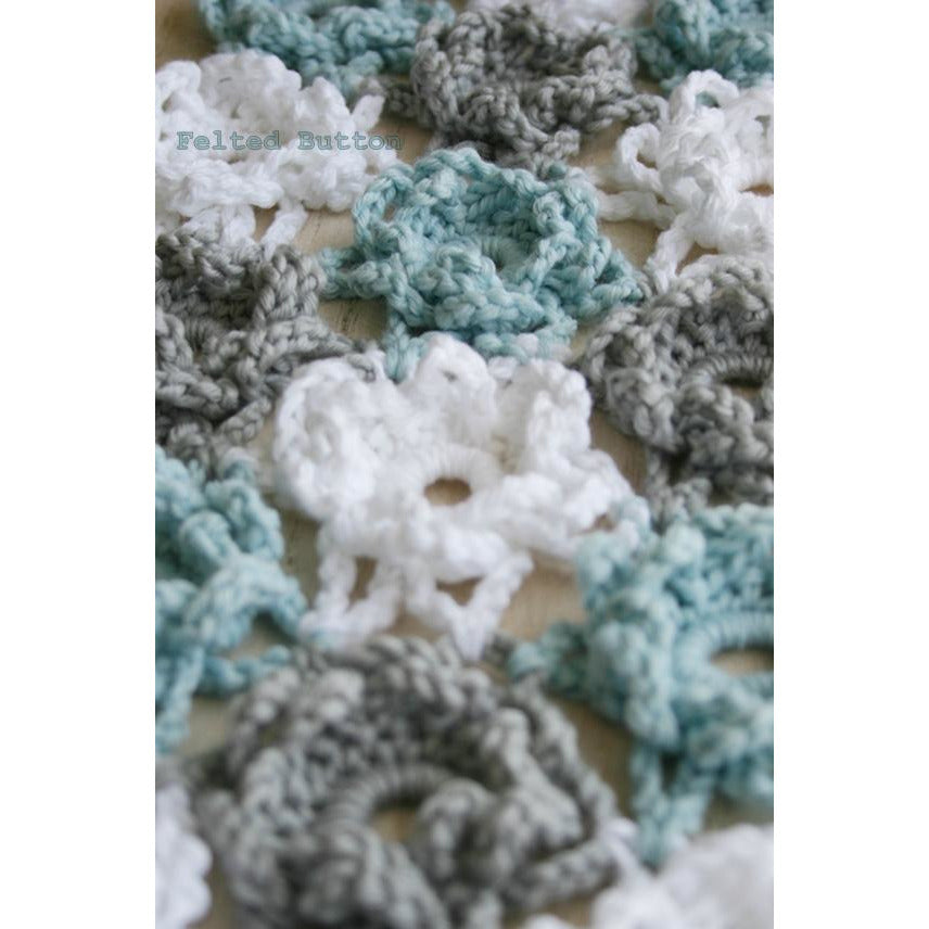 Loopsy Daisy Cover and Shawl free crochet pattern by Susan Carlson of Felted Button, loopy blue white and grey flowers to cover bed or worn