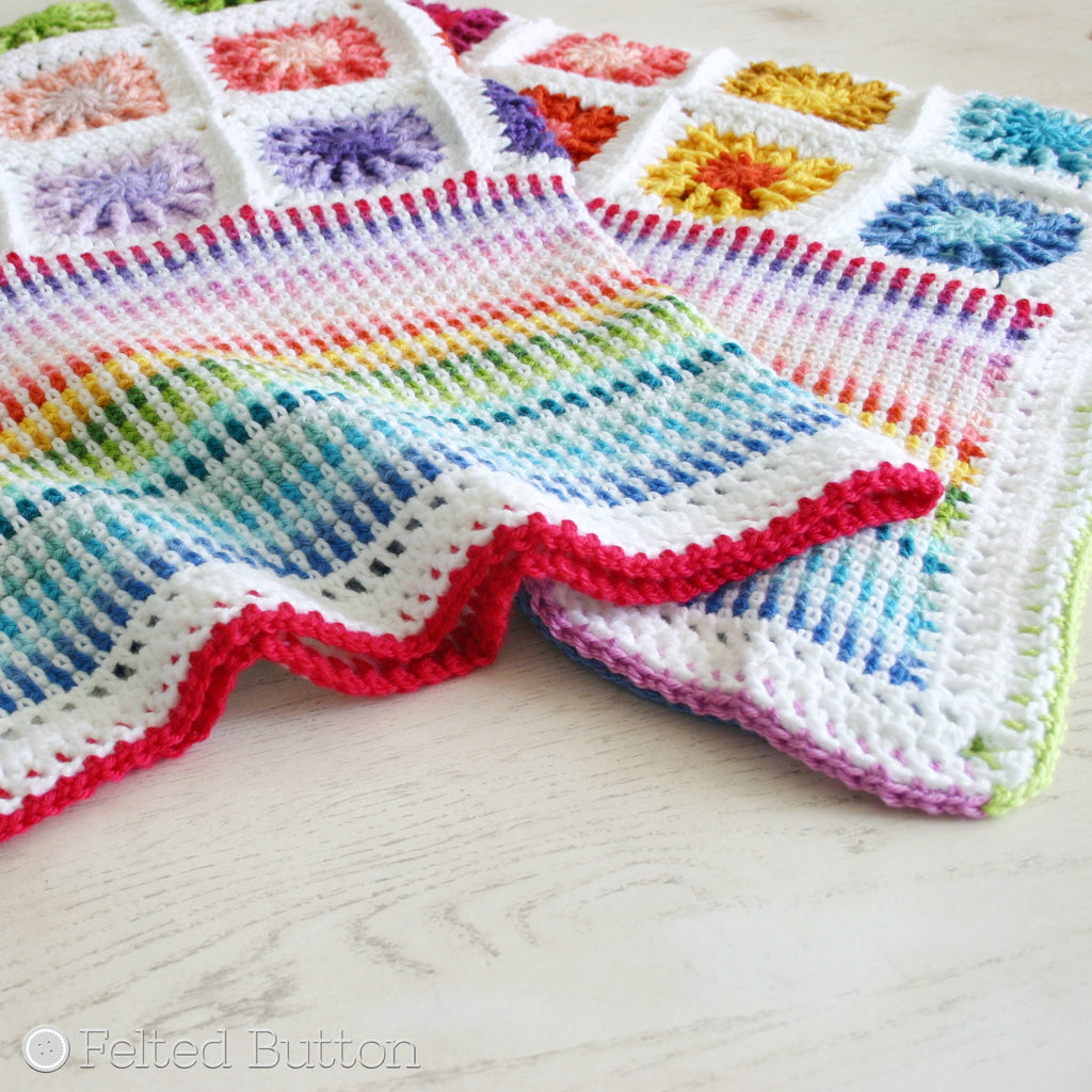 Rainbow colors of textured granny square motifs with colorful linen stitch border--Around the Corner Blanket crochet pattern by Susan Carlson of Felted Button