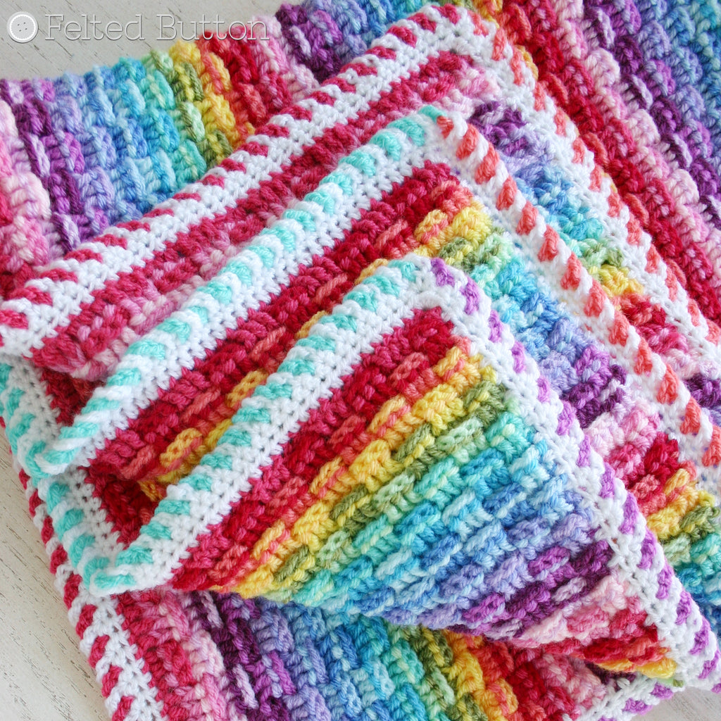 Basket of Rainbows Blanket crochet pattern by Susan Carlson of Felted Button, striped rainbow blanket using Scheepjes Colour Crafter yarn for baby or home