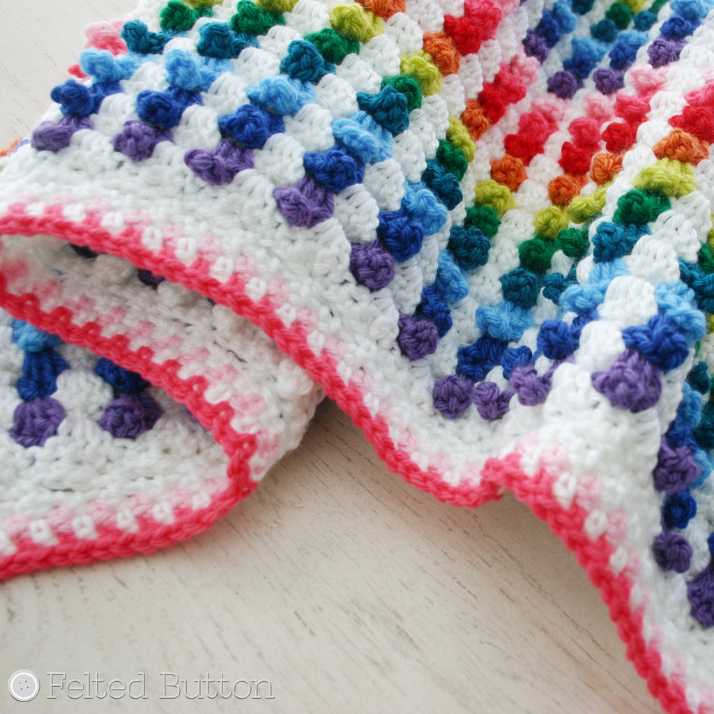 Textured rainbow crochet blanket with stitches like cupcakes, Cuppy Cakes Blanket designed by Susan Carlson of Felted Button, colorful crochet patterns