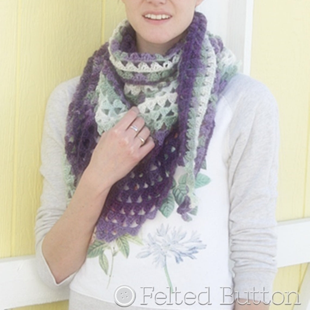 Pretty girl against yellow background wearing purple kerchief scarf around neck, Triangle of Triangles Scarf crochet pattern by Susan Carlson of Felted Button