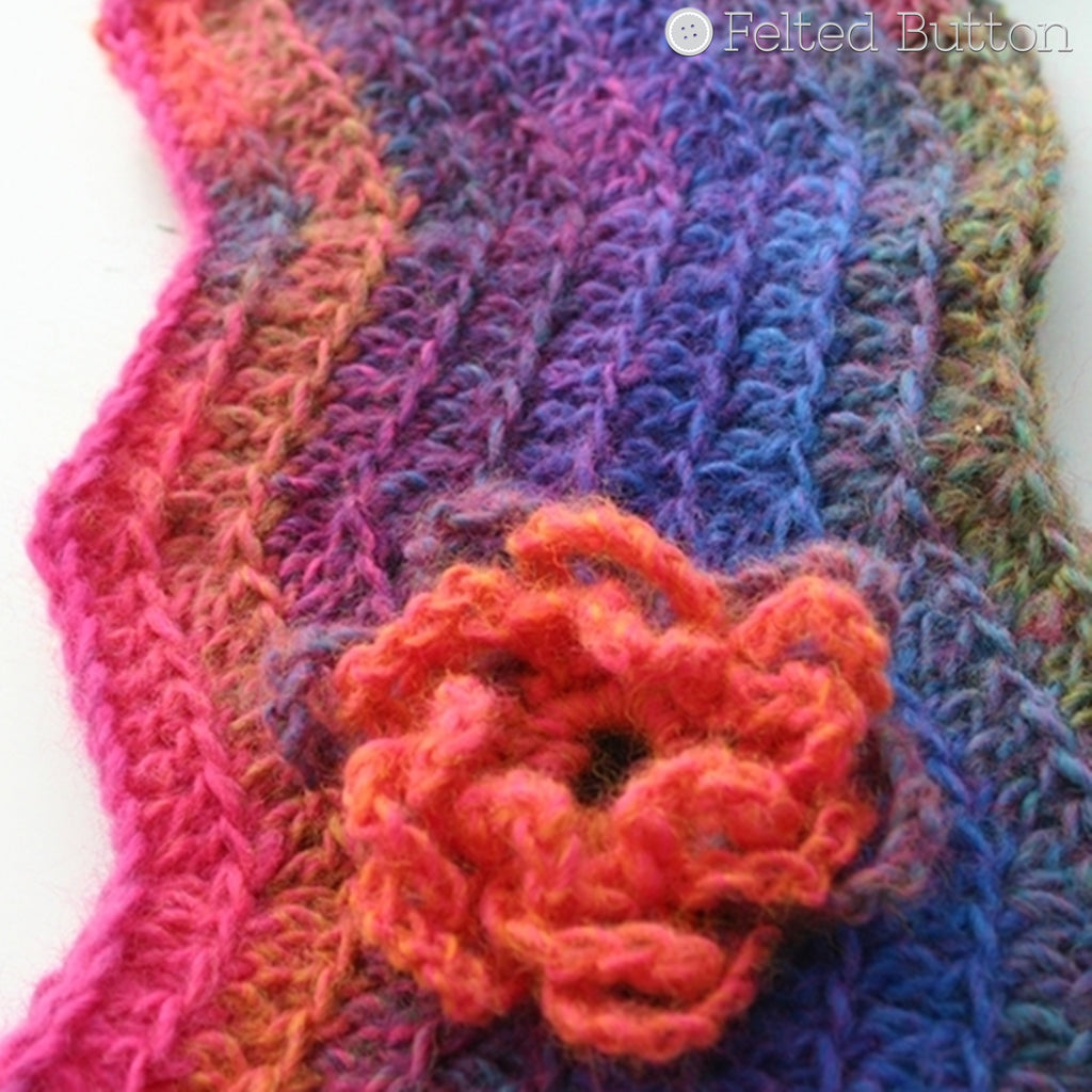 Bright rainbow ripple cowl with loopy textured crochet flower, Watercolor Waves Cowl free crochet pattern by Susan Carlson of Felted Button