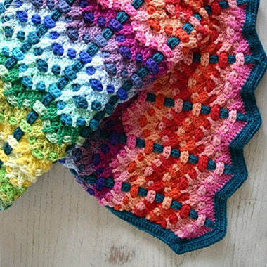 Rainbow of color baby afghan by Susan Carlson of Felted Button, colorful crochet patterns for Chromatic Cobbles Blanket, textured crochet afghan