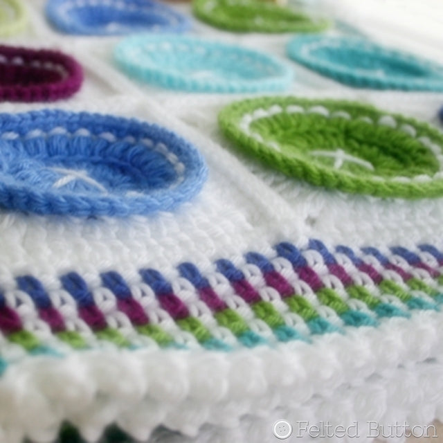 Bright as a Button blanket crochet pattern in blues, purples and greens, by Susan Carlson of Felted Button | Colorful Crochet Patterns
