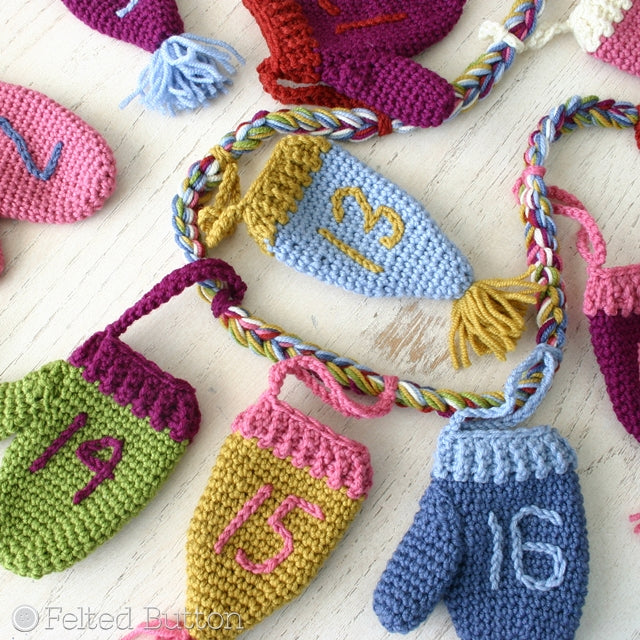 Cozy Christmas Countdown hanging advent calendar of mini crochet mittens and hats with poms, crochet pattern by Susan Carlson of Felted Button | Colorful Crochet Patterns