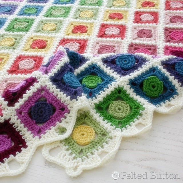 Rainbow granny square blanket with circle centers, Circle Takes the Square Blanket, crochet afghan pattern by Susan Carlson of Felted Button | Colorful Crochet Patterns, Knit Picks Comfy yarn