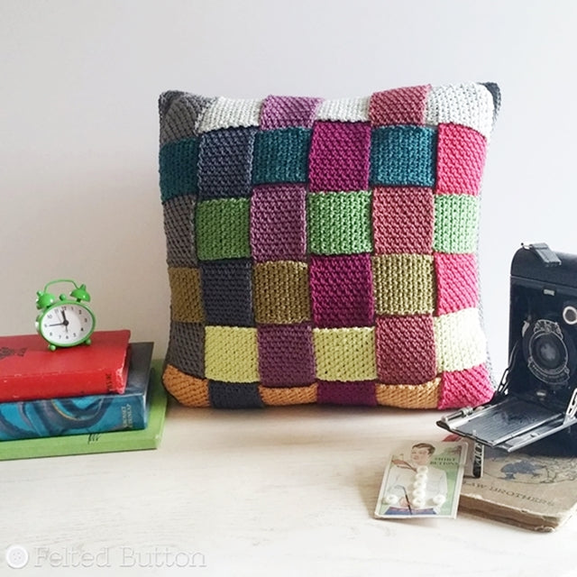 Crisscross Cushion Cover crochet pattern using Scheepjes Catona, styled with vintage camera, books and wee clock, free crochet pattern by Susan Carlson | Felted Button | Colorful Crochet Patterns