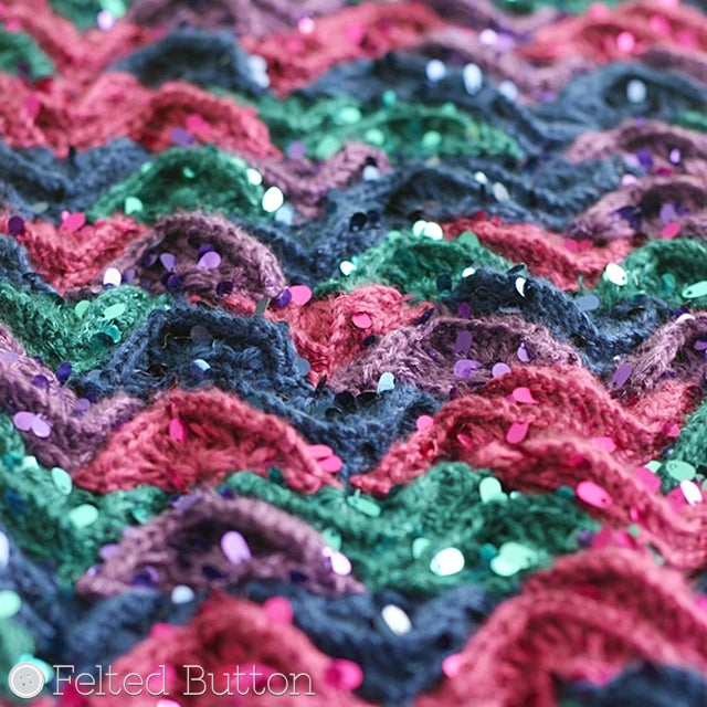 Close up of pink, purple, blue and teal sparkly scales of mermaid tail crochet blanket by Susan Carlson of Felted Button | Colorful Crochet Patterns, Mermaid Me Blanket