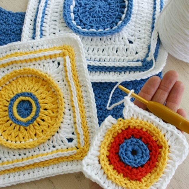 Crochet squares with colorful centers, designed by Susan Carlson of Felted Button | Colorful Crochet Patterns