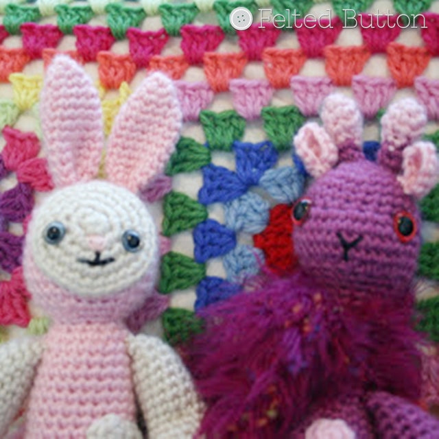 Amigurumi Bunny and giraffe in pink and purple against rainbow granny pillow background, Susan Carlson of Felted Button | Colorful Crochet Patterns