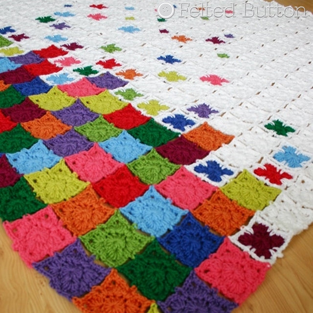 Rainbow Sprinkles Blanket, crochet afghan or throw pattern with rainbow squares "falling" into pile at end of blanket, Susan Carlson of Felted Button | Colorful Crochet Patterns