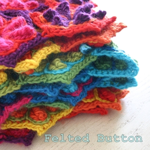 Rainbow textured crochet wool mat or blanket folded, Star Fruit Blanket or Rug, crochet pattern by Susan Carlson of Felted Button | Colorful Crochet Patterns