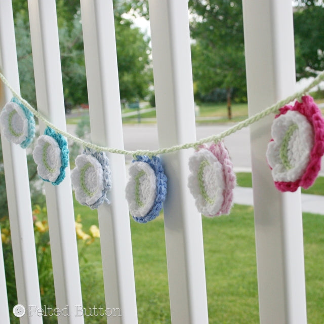 Cotton layered flowers with white center, bunting or garland hanging on banister, free crochet pattern by Susan Carlson of Felted Button | Colorful Crochet Patterns, Summer Flower Bunting