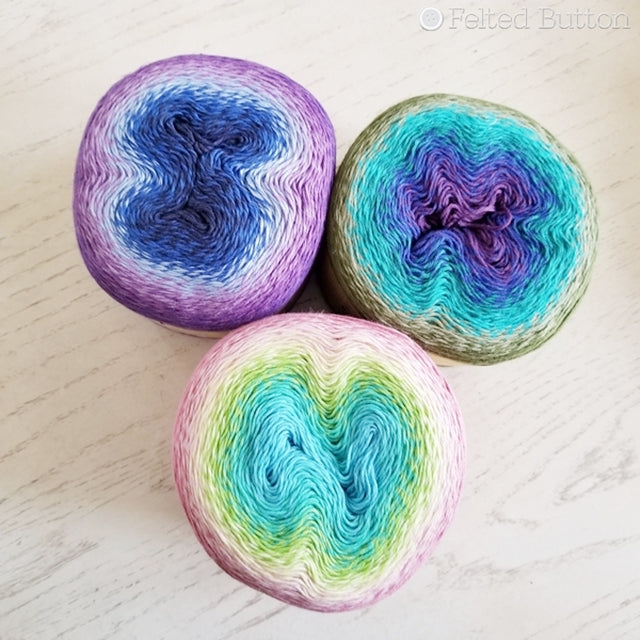 Three Scheepjes Whirl yarn cakes in pinks and greens and blues for Trio Blanket, free crochet pattern  by Susan Carlson of Felted Button colorful crochet patterns 