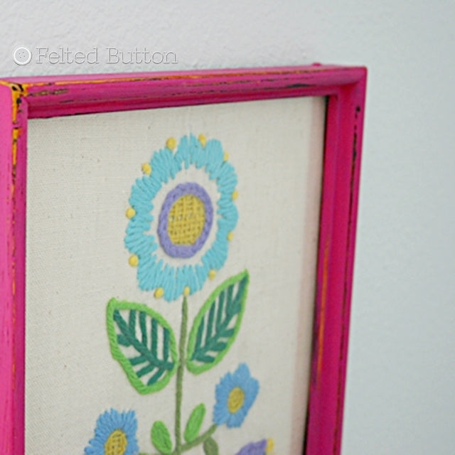 Pink framed simple vintage embroidery of flower, Susan Carlson of Felted Button | Colorful Crochet Patterns