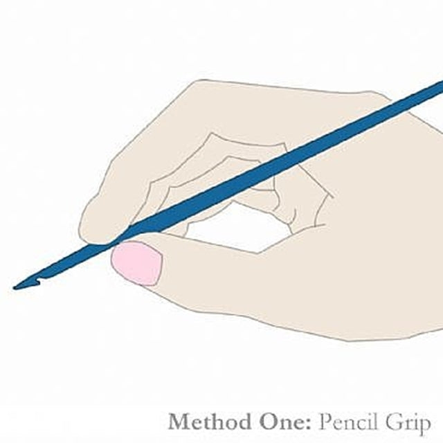 Image of hand holding crochet hook in pencil grip, Susan Carlson of Felted Button | Colorful Crochet Patterns