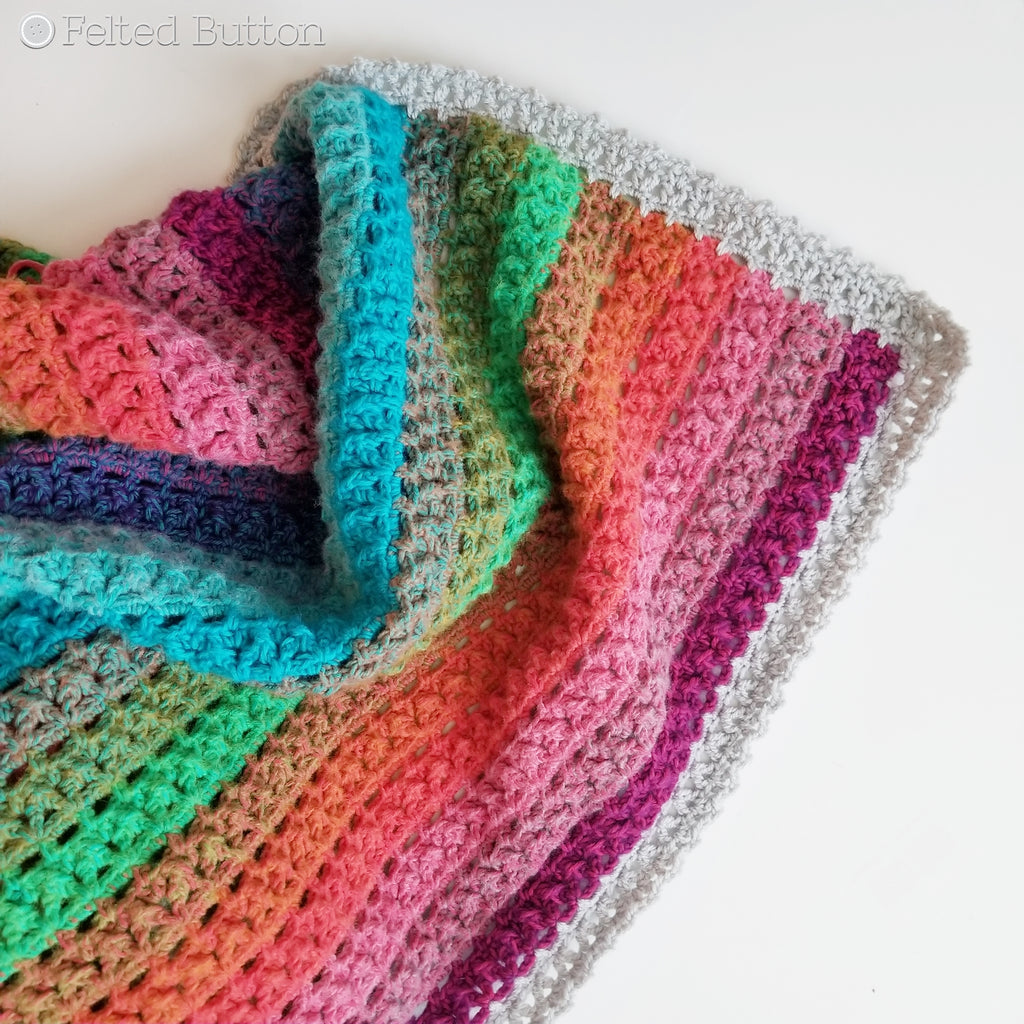 Elan Blanket crochet pattern, rainbow striped throw designed by Susan Carlson of Felted Button | Colorful crochet patterns | made using Scheepjes River Washed and Scheepjes Colour Crafter yarns