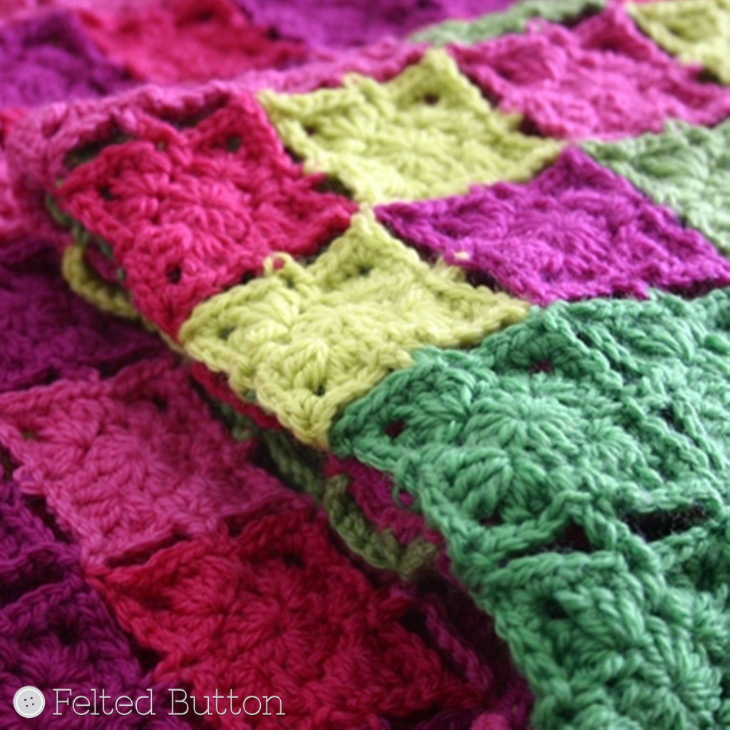 Pink and green scattered granny squares blanket, colorful crochet pattern Flying Colors throw by Susan Carlson of Felted Button