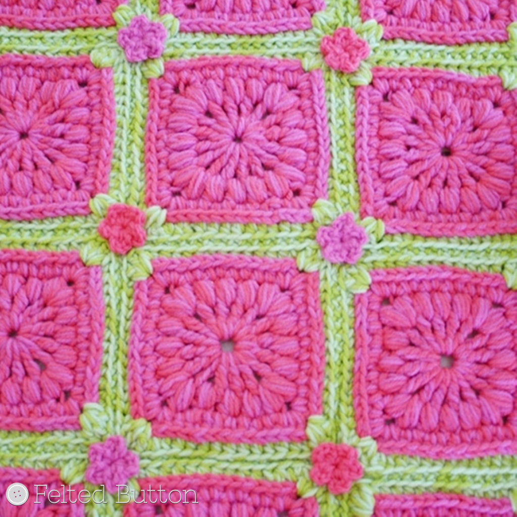 Pink and green, textured, granny square rug with wee flowers, Melon Berry Rug colorful crochet pattern by Susan Carlson of Felted Button