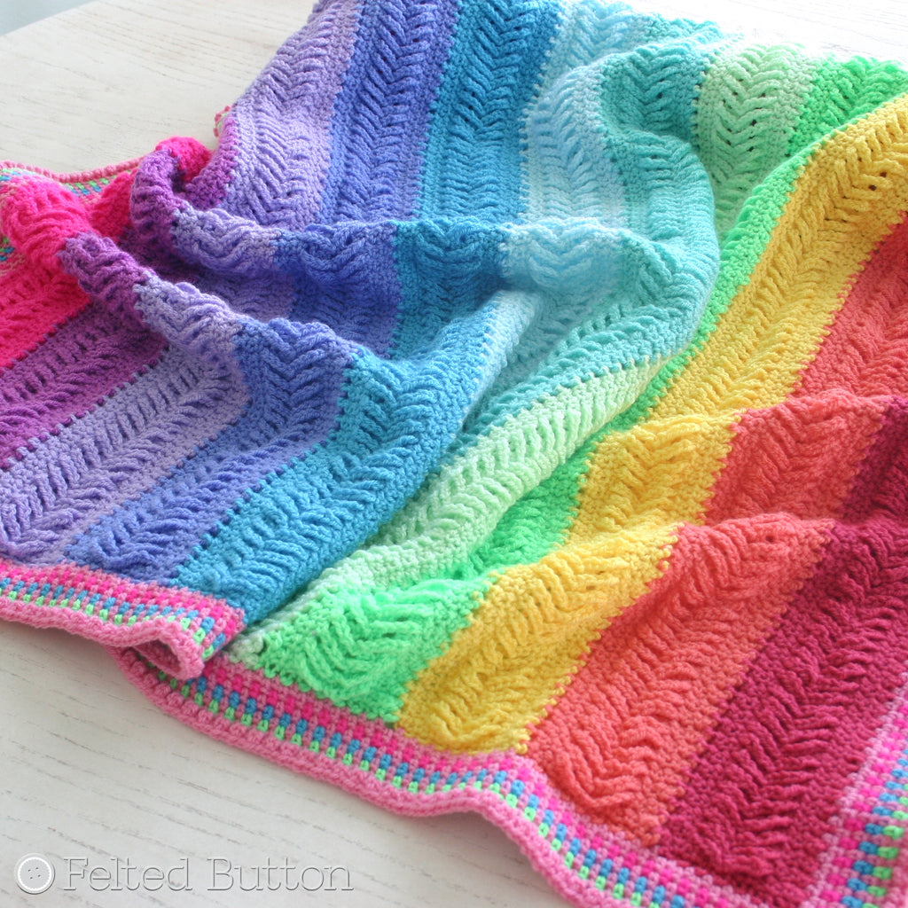 Woven looking crochet blanket in colorful rainbow stripes, Plaited Throw by Susan Carlson of Felted Button