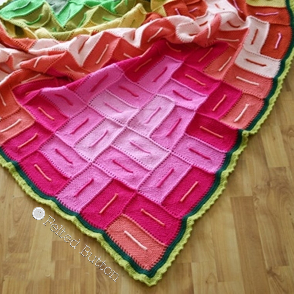 Graphic rectangles in pink, orange and green resemble a flower, Radiant Blanket crochet afghan pattern by Susan Carlson of Felted Button