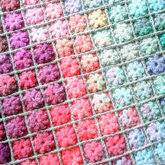 Small crochet flower motifs with rainbow watercolor effect, Painted Pixels Blanket for baby or afghan, colorful crochet pattern by Susan Carlson of Felted Button