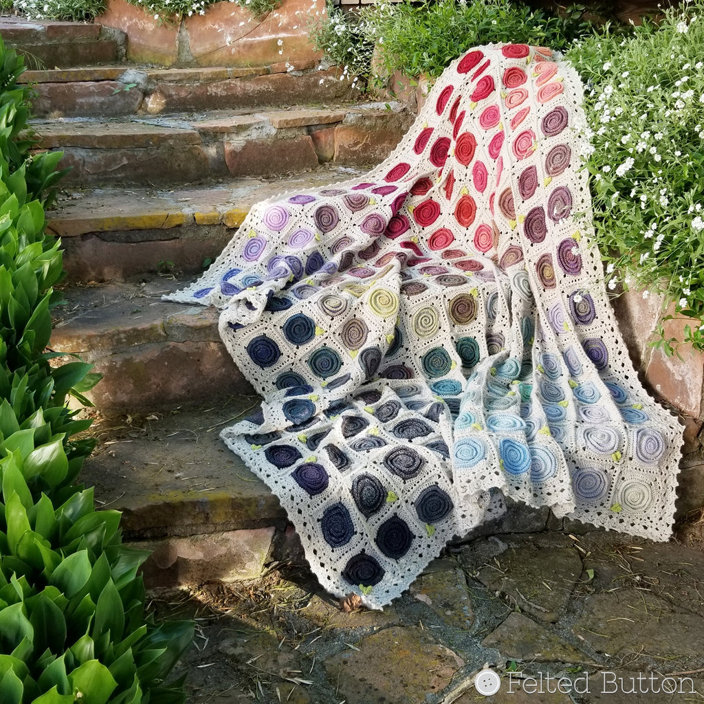 Colorful gradient of swirls on crochet blanket, Sweven Throw crochet afghan pattern by Susan Carlson of Felted Button 
