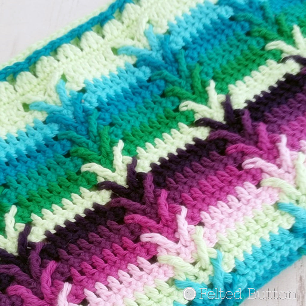 Purples and greens in cotton crochet striped blanket with arrows, This Way Blanket crochet pattern by Susan Carlson of Felted Button