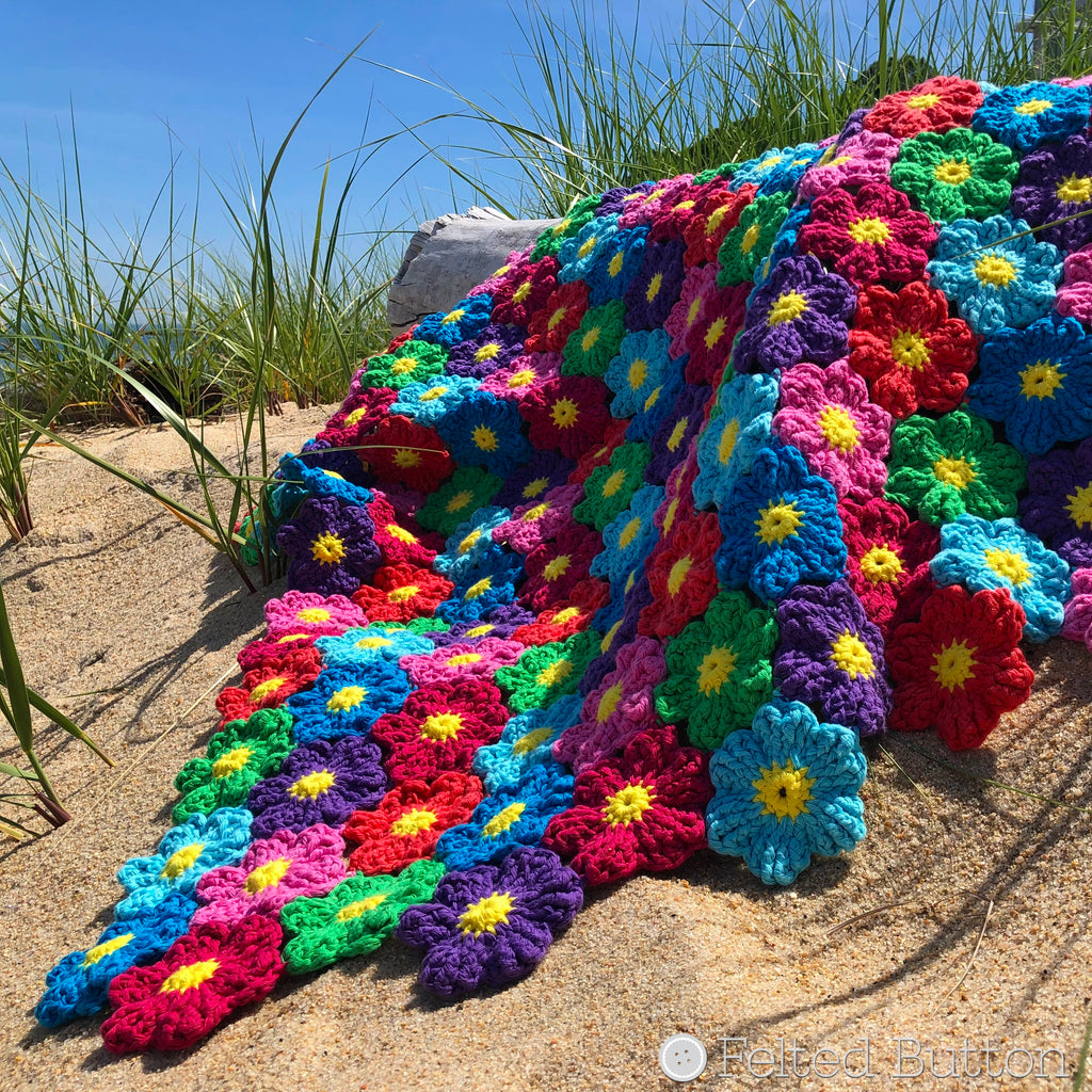Textured and rainbow colored crochet flower blanket, Waikiki Wildflower Blanket, crochet pattern by Susan Carlson of Felted Button