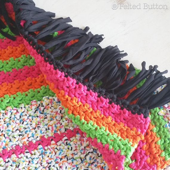 All Sorts Rug that looks like all-sorts candy colors, made with Scheepjes Nooodles t-shirt yarn, striped and fringed